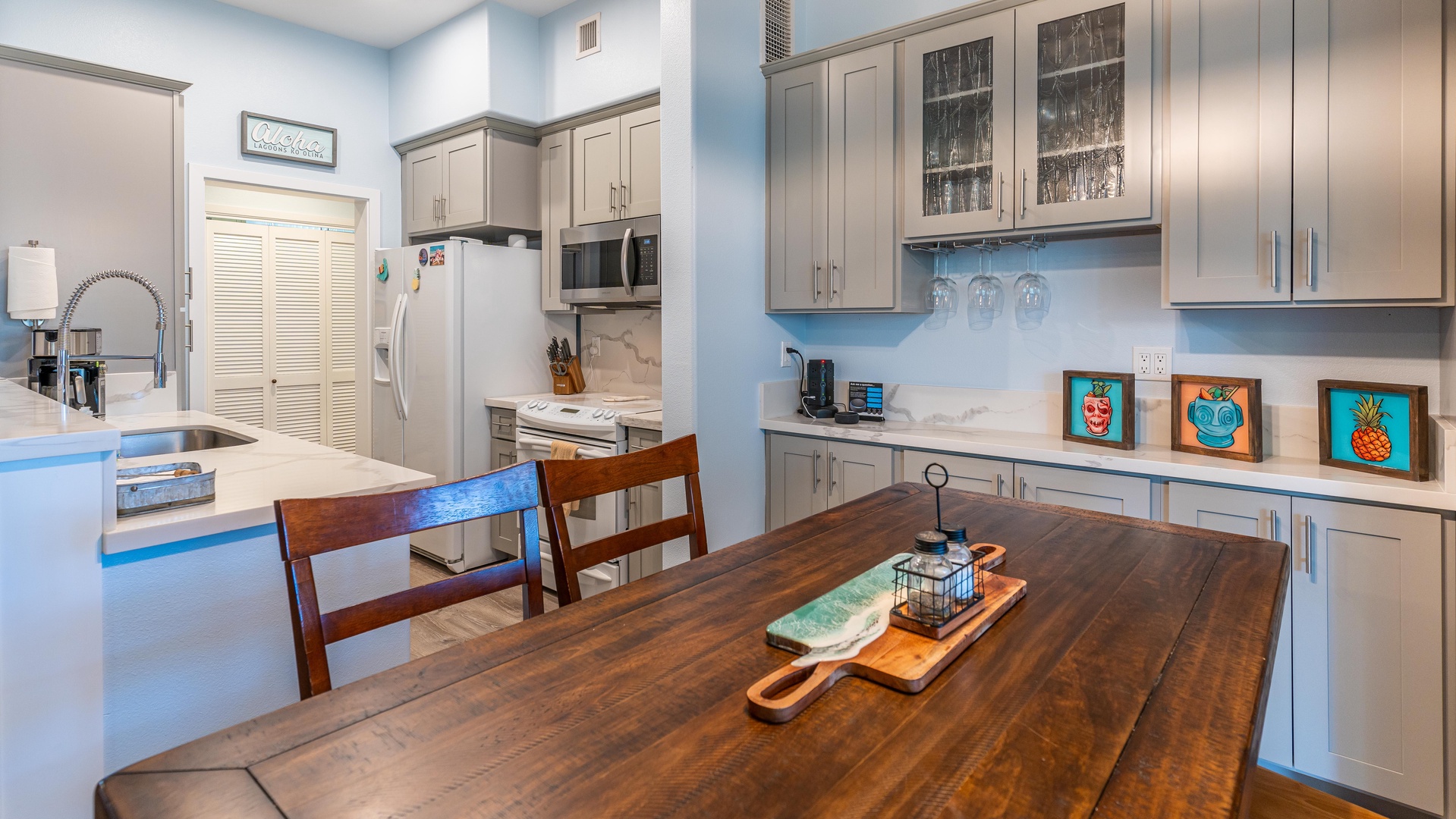 Kapolei Vacation Rentals, Coconut Plantation 1214-2 Aloha Lagoons - The intricate grain of the solid wood table under boutique lighting.