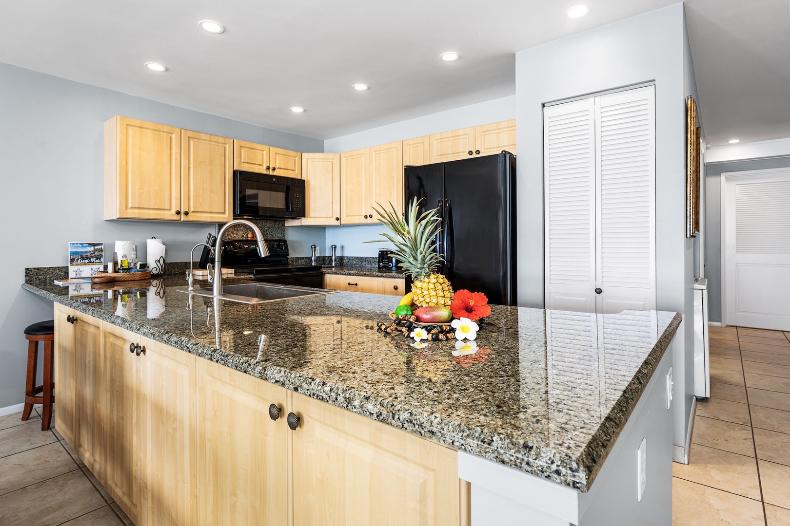 Kailua Kona Vacation Rentals, Sea Village 1105 - Spacious granite countertops and ample cabinetry make this kitchen ideal for prepping fresh island meals.