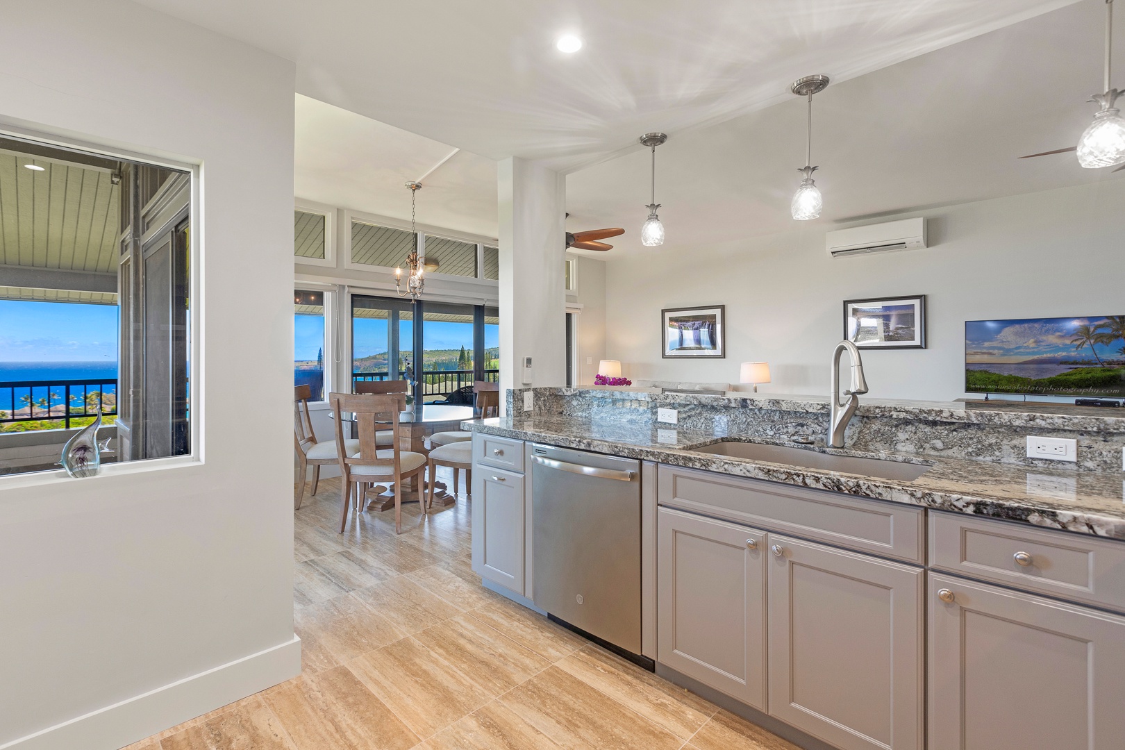 Lahaina Vacation Rentals, Kapalua Ridge 1622 - The modern kitchen features granite countertops, stainless steel appliances, and an open layout, allowing for easy interaction with family or friends