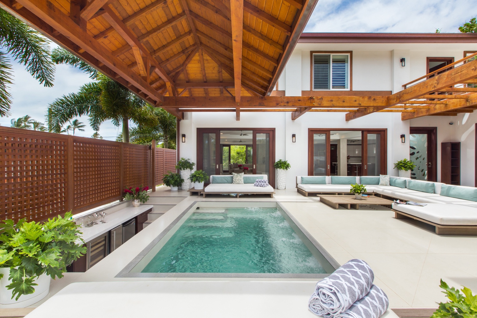 Honolulu Vacation Rentals, Diamond Head Villa* - Tranquil private pool framed by wood-beamed ceilings and breezy outdoor seating.