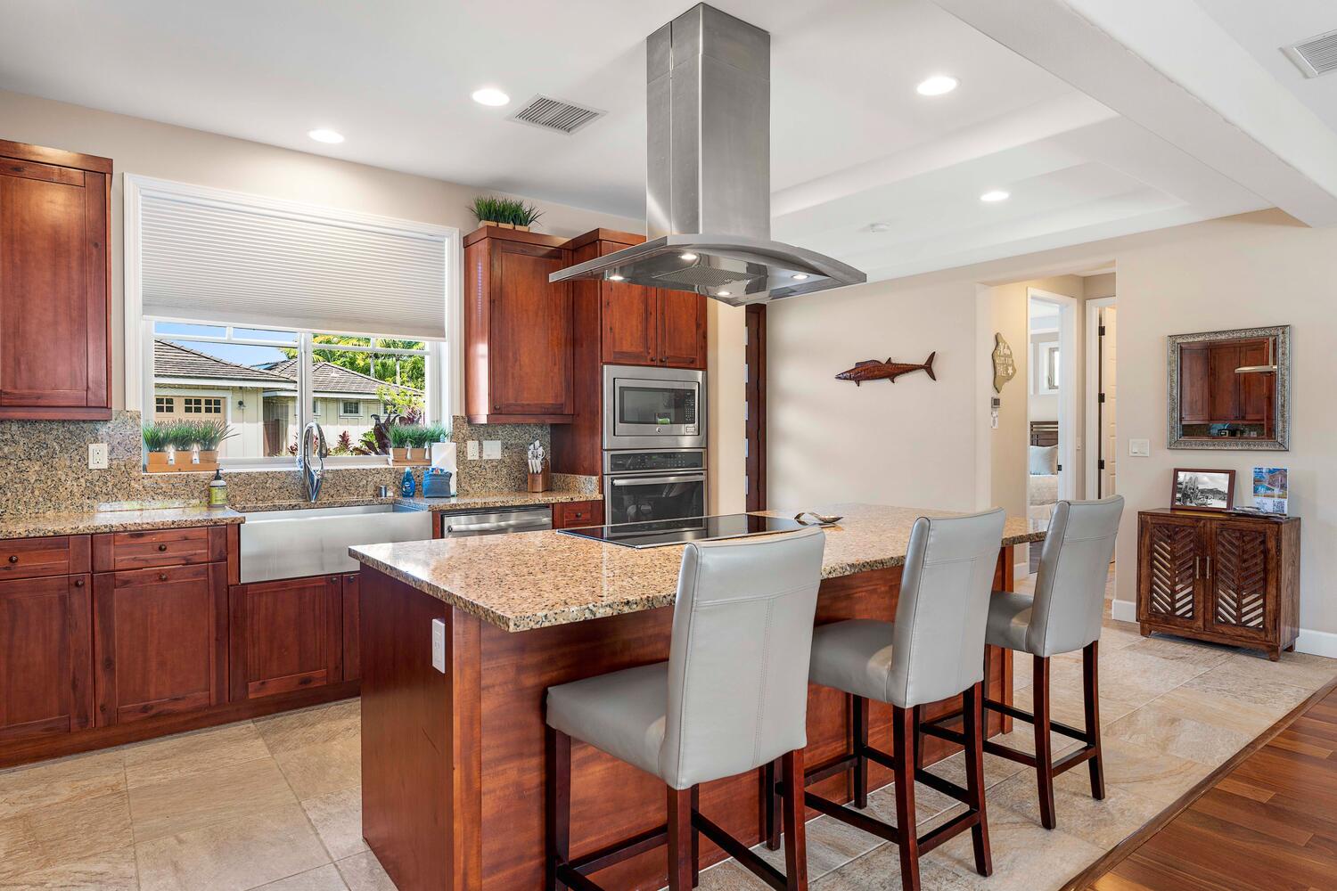 Kailua Kona Vacation Rentals, Holua Kai #32 - A gorgeous gourmet kitchen with fine finishes such as granite counter tops and solid wood cabinets flows into an expansive great room.