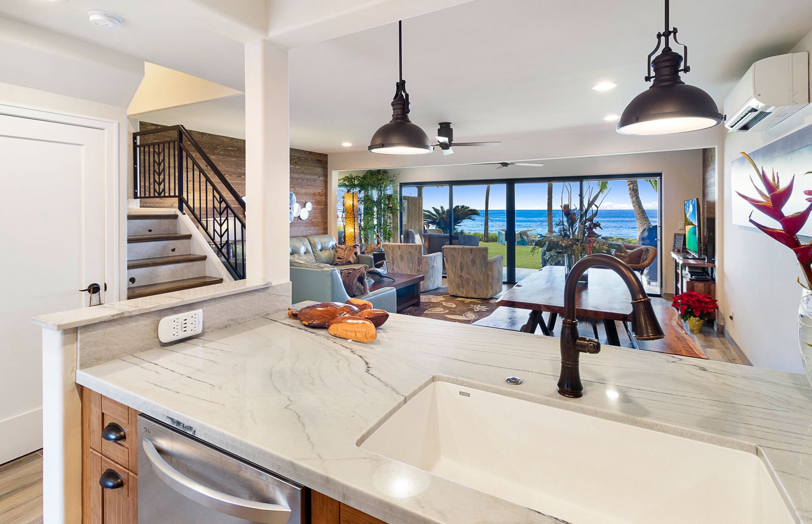 Lahaina Vacation Rentals, Puamana 240-3 - Spacious kitchen with an open-concept design, seamlessly connecting to the dining and living spaces.