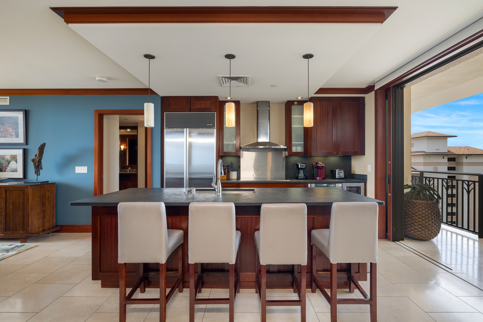 Your gourmet kitchen features a spacious island with bar seating, perfect for morning coffee or casual meals together.