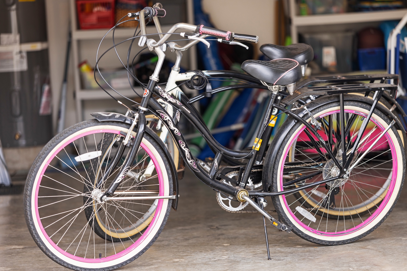 Kapolei Vacation Rentals, Ko Olina Kai 1105E - Two stylish cruiser bikes with pink-rimmed wheels stand ready in the garage, perfect for your leisurely rides around the neighborhood or to nearby attractions.
