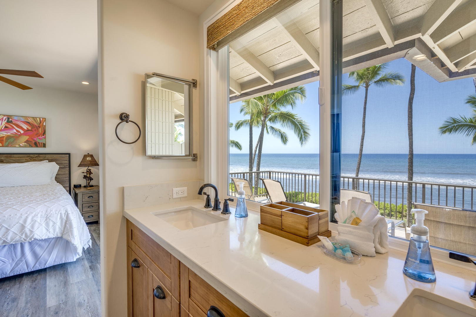 Lahaina Vacation Rentals, Puamana 240-3 - Refresh in a stylish Primary Ensuite with a scenic tropical backdrop.