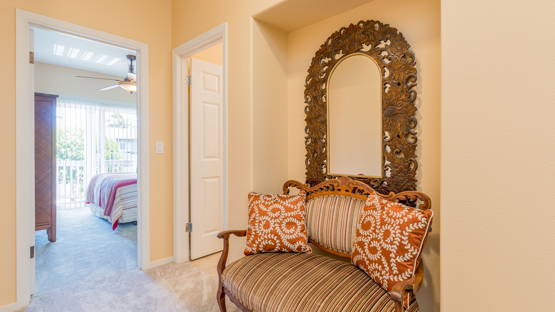 Kapolei Vacation Rentals, Coconut Plantation 1192-4 - A classic settee and  Polynesian mirror in the home.