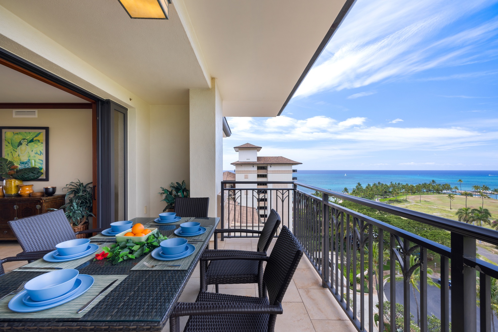 Kapolei Vacation Rentals, Ko Olina Beach Villas O1111 - Savor your morning coffee on this stunning balcony overlooking the azure ocean. Spacious dining table perfect for memorable meals with breathtaking coastal views.