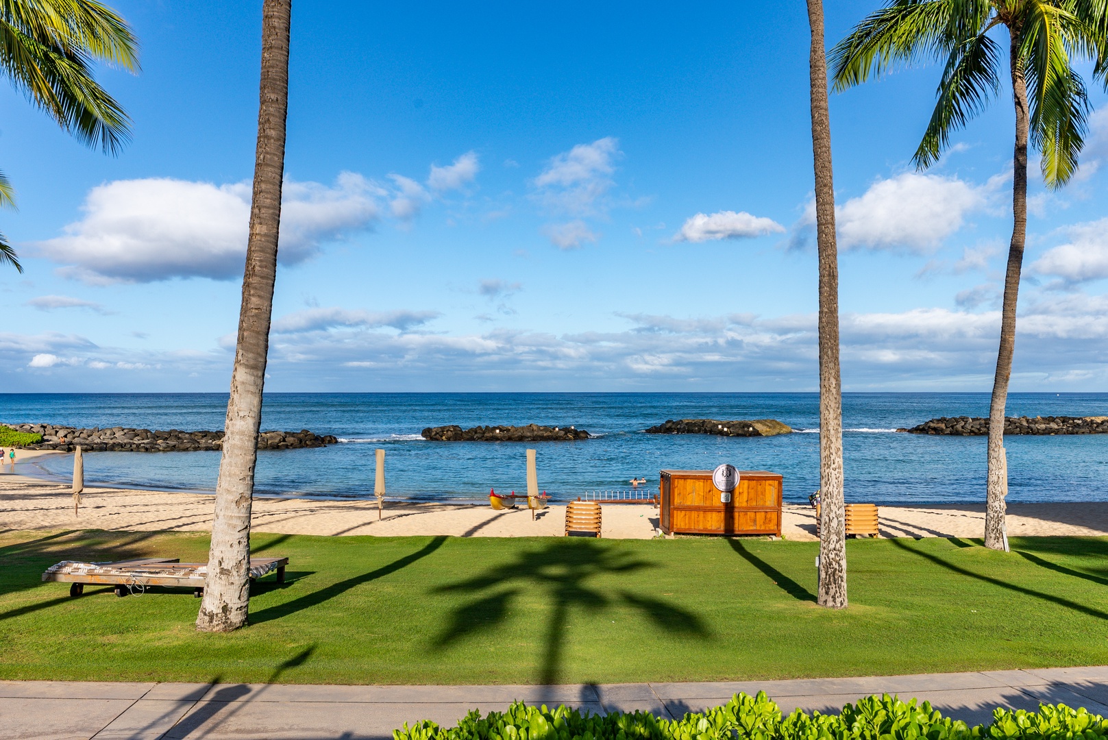 Cross the lawn to the water, the lagoon breakwater flattening the surf.