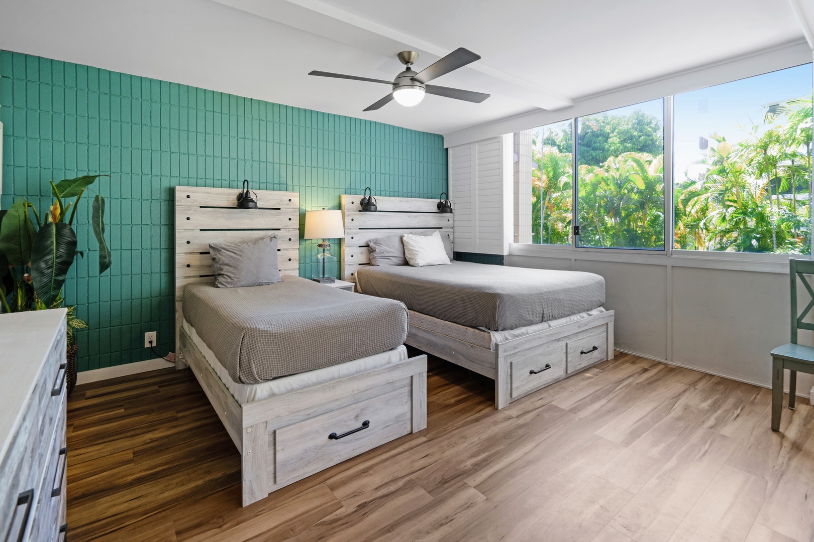 Kihei Vacation Rentals, Haleakala Shores A206 - A twin bed and a queen bed sit side by side, both getting to enjoy the views beyond the window.