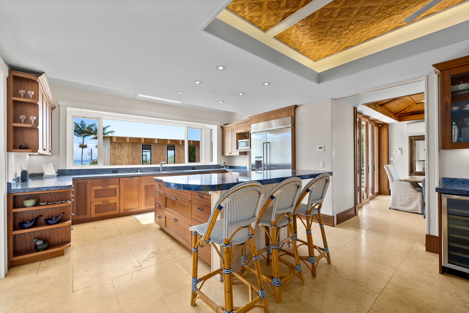 Kailua Vacation Rentals, Leaf House - Your gourmet kitchen awaits with custom cabinetry, ocean views, and a welcoming island where you can gather for meals and conversation in tropical elegance.