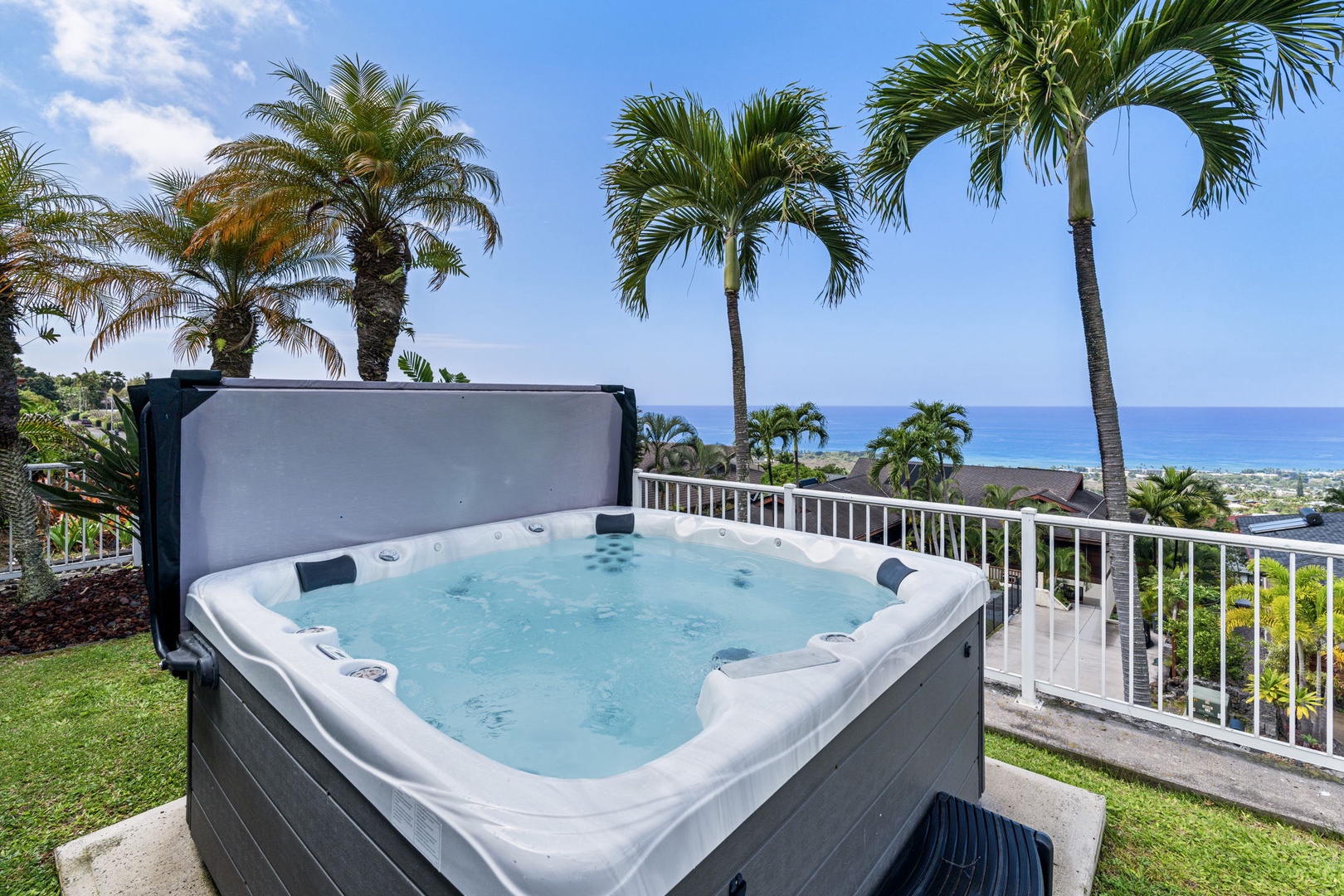 Kailua-Kona Vacation Rentals, Honu Hale - Soak in your private hot tub with stunning ocean views framed by tropical palms—pure paradise awaits.