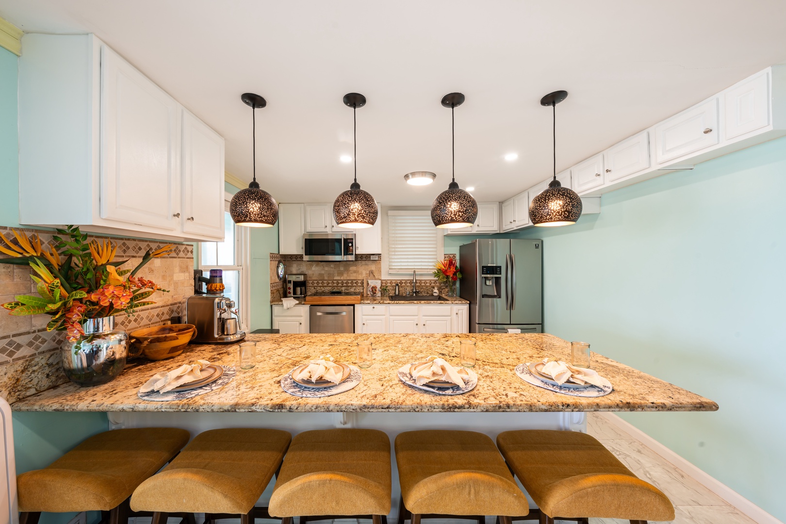 Hauula Vacation Rentals, Private Beach Paradise - Pendant lights over a bar that seats the whole group for a slow morning.