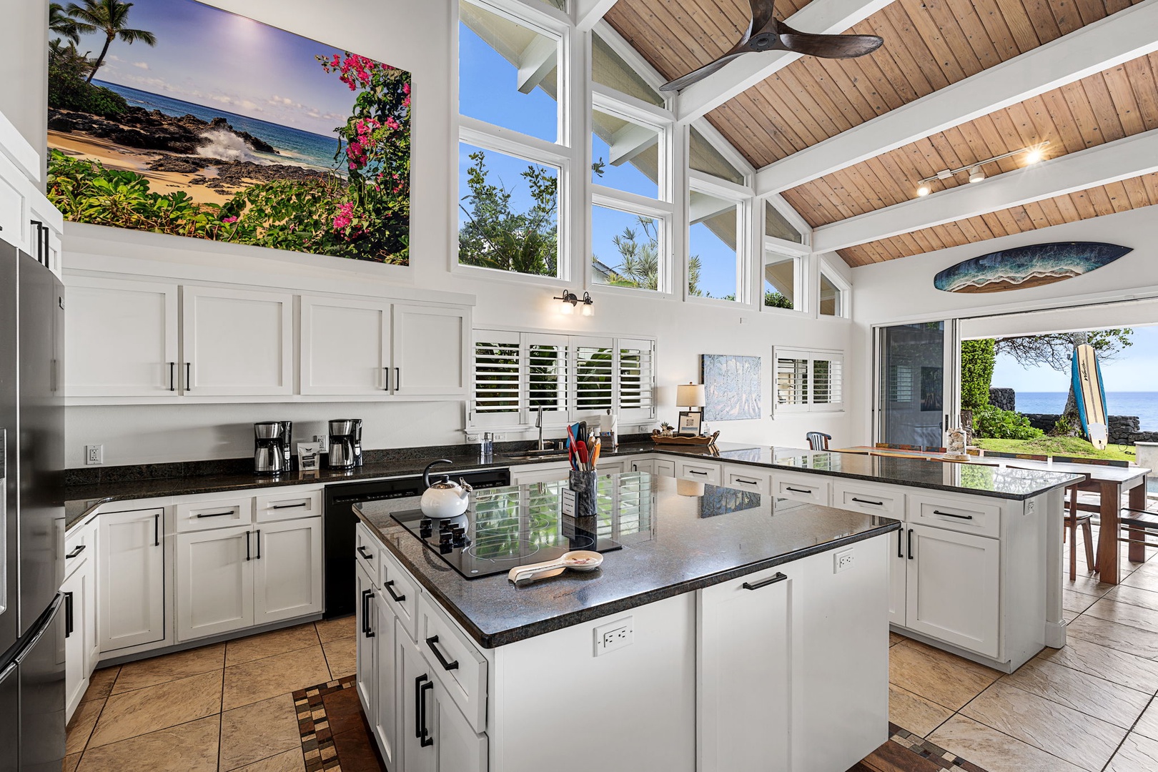 Kailua Kona Vacation Rentals, Hale Pua - Prepare meals in a light-filled kitchen, with vaulted ceilings and ocean views beyond.