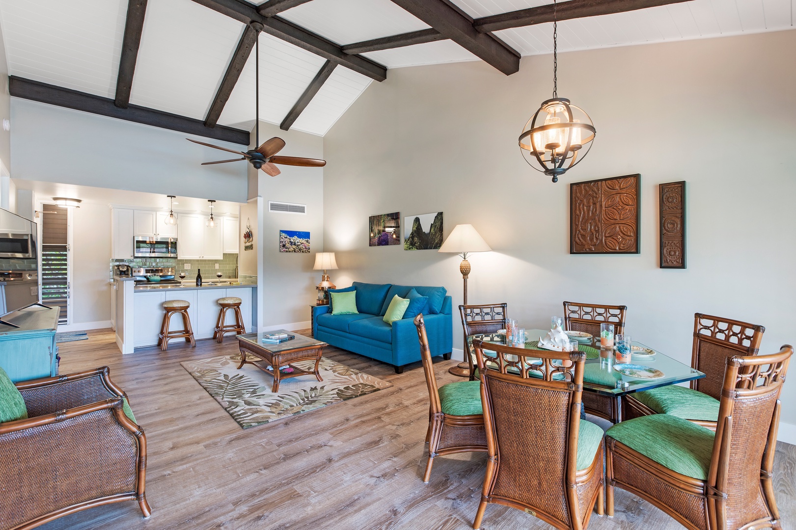 Lahaina Vacation Rentals, Maui Kaanapali Villas 292 - Enjoy meals at the glass-top dining table, or relax on the vibrant blue sofa under the high-vaulted ceilings