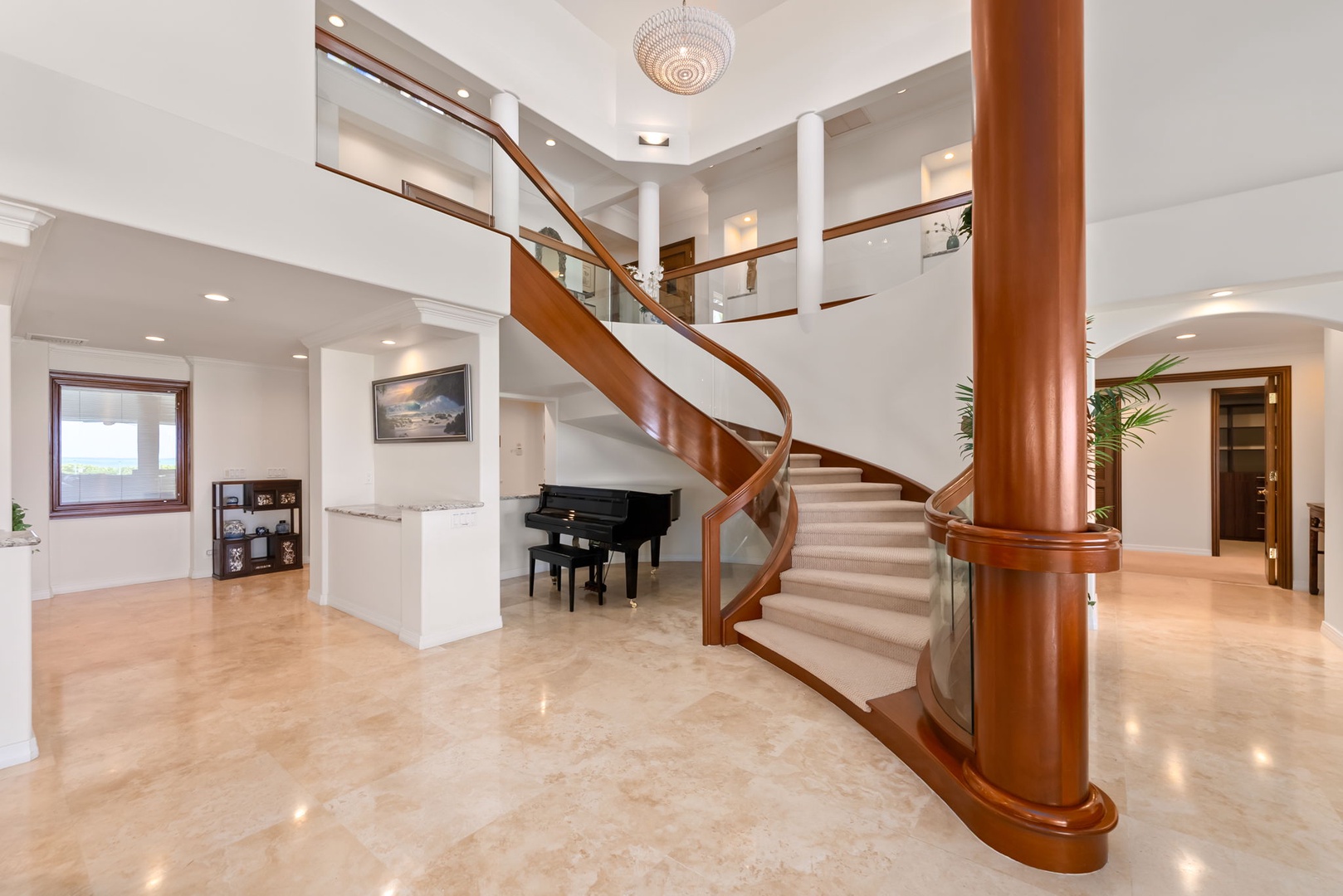 Honolulu Vacation Rentals, Maunalua Estate - The graceful spiral staircase and grand piano create a striking first impression upon arrival.