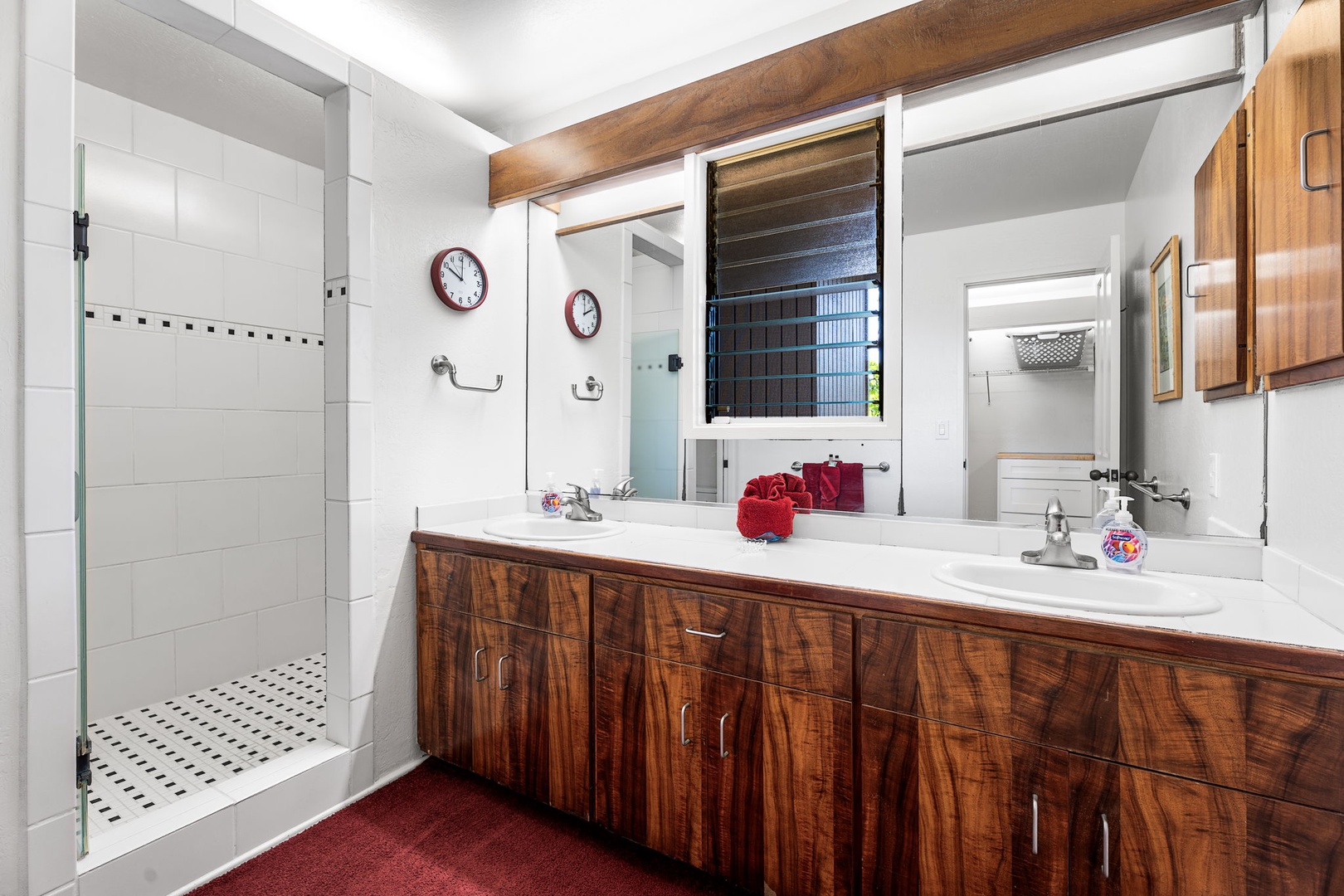 Kailua Kona Vacation Rentals, Kanaloa at Kona 701 - Enjoy your spacious bathroom with dual sinks and elegant wood vanity, plus a refreshing walk-in shower to start your day perfectly.