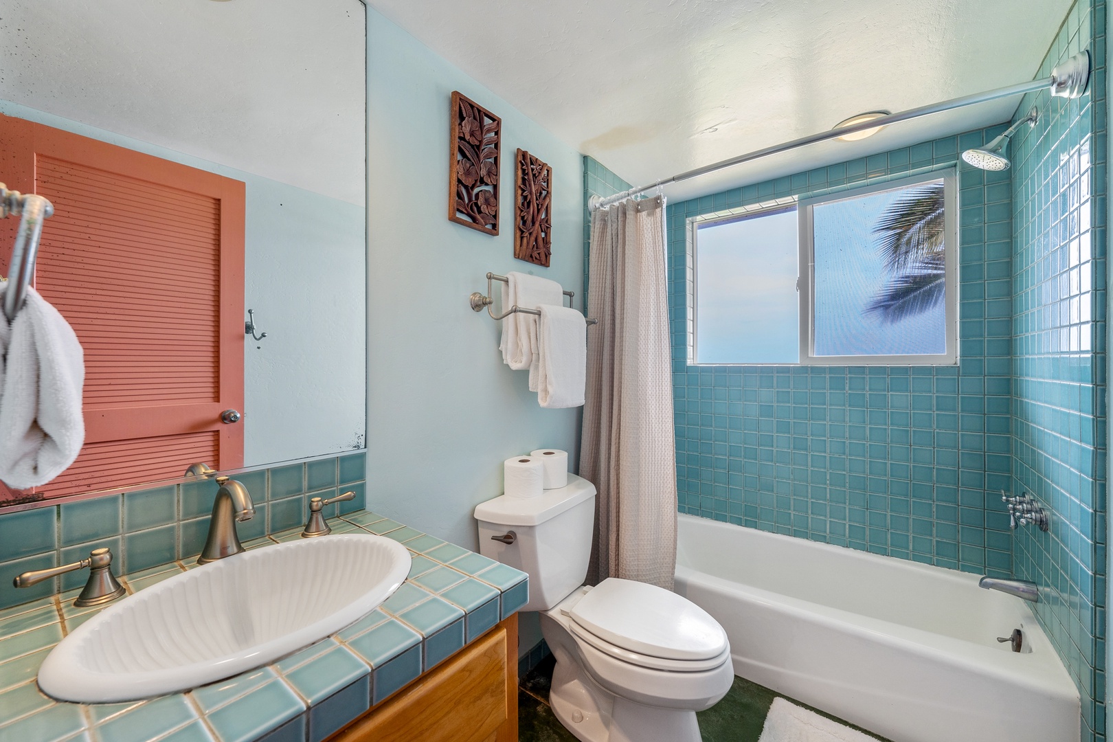 Hanalei Vacation Rentals, Hale Kepuhi - Refresh in your turquoise-tiled bathroom with tropical palm views and thoughtful touches like plush towels and decorative artwork.