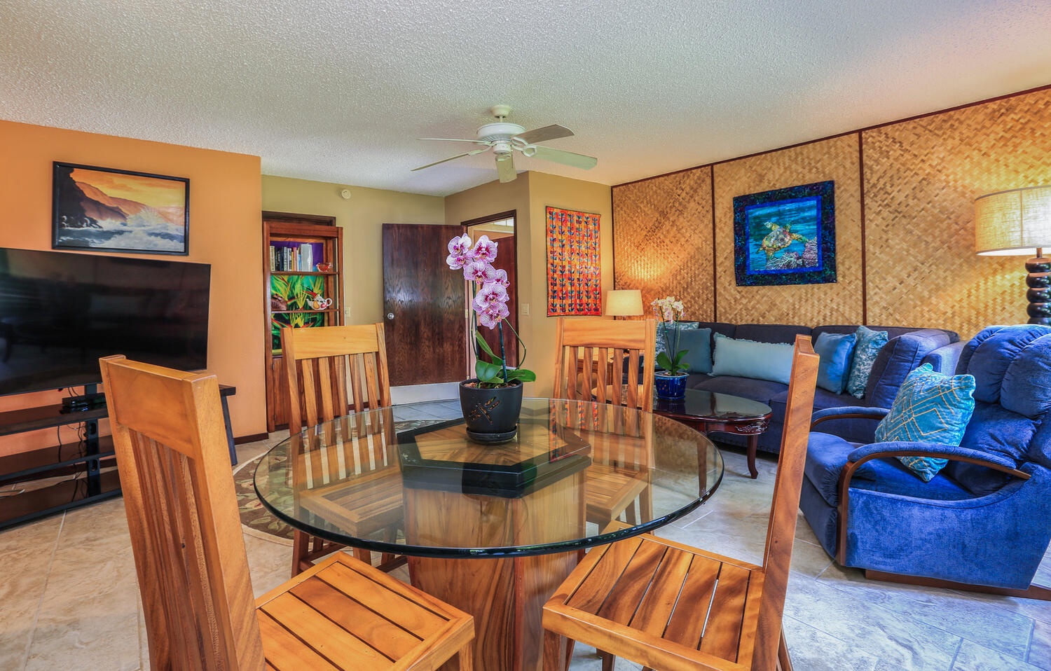 Princeville Vacation Rentals, Hideaway Haven - Glass dining table with four seats adjacent to the living area