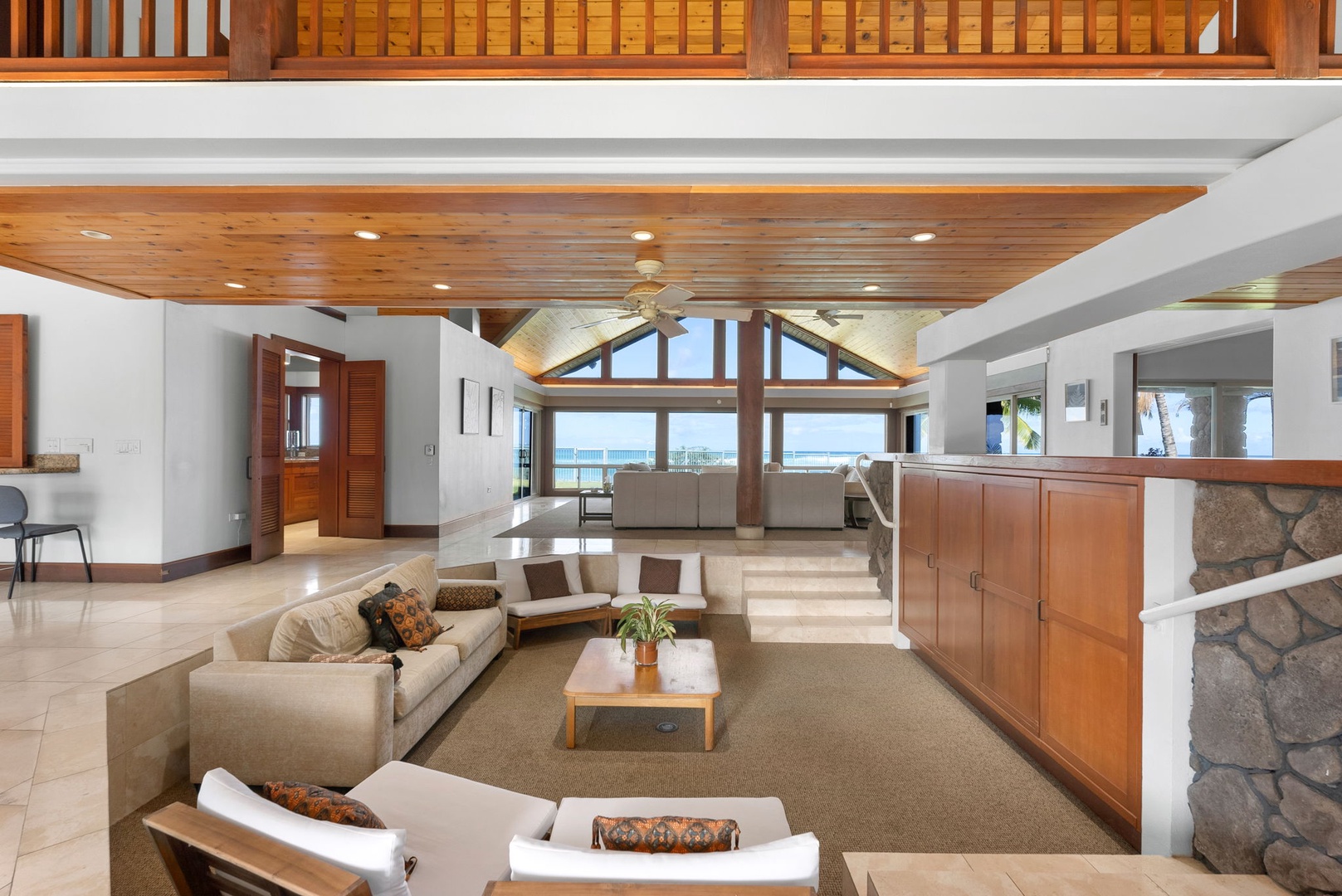 Waianae Vacation Rentals, Konishiki Beachhouse - 4BD - Elegant main living area with plush seating, vaulted ceilings, and postcard-perfect views.