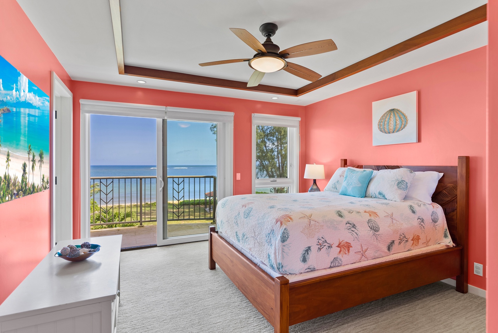 Waialua Vacation Rentals, Kala'iku Main - Junior primary suite with pillow-top queen bed and balcony with view of pool and ocean