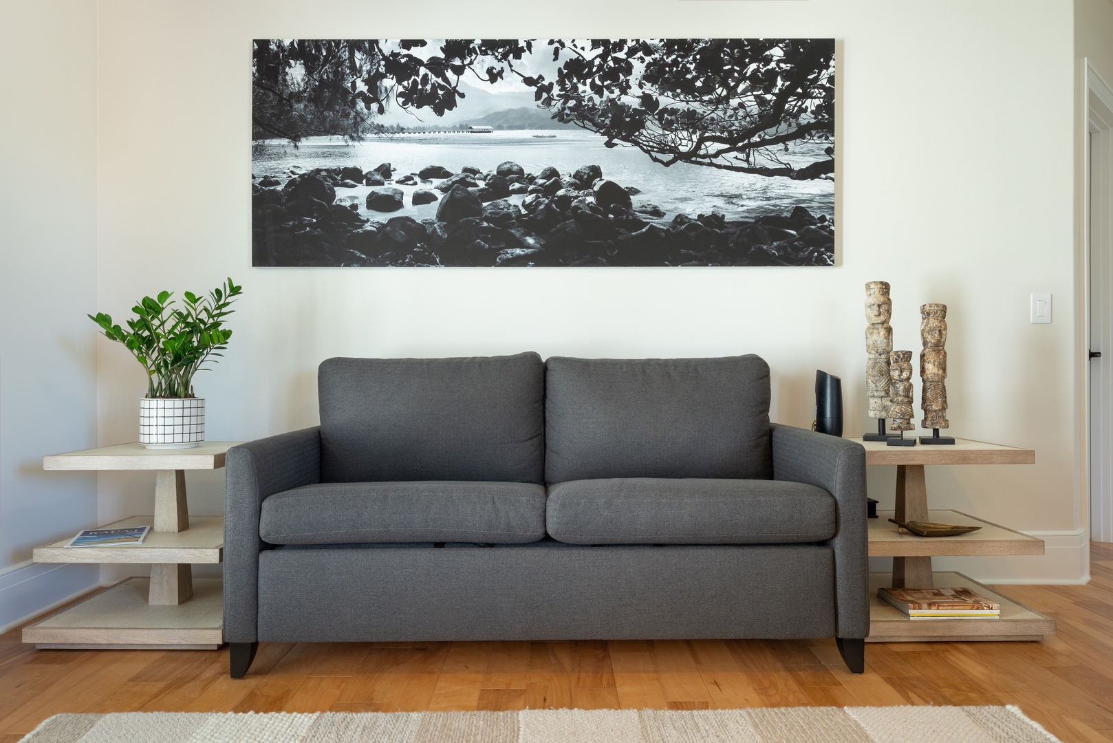 Princeville Vacation Rentals, Hihimanu House - Comfortable sitting area with a sleek gray sofa and modern decor.