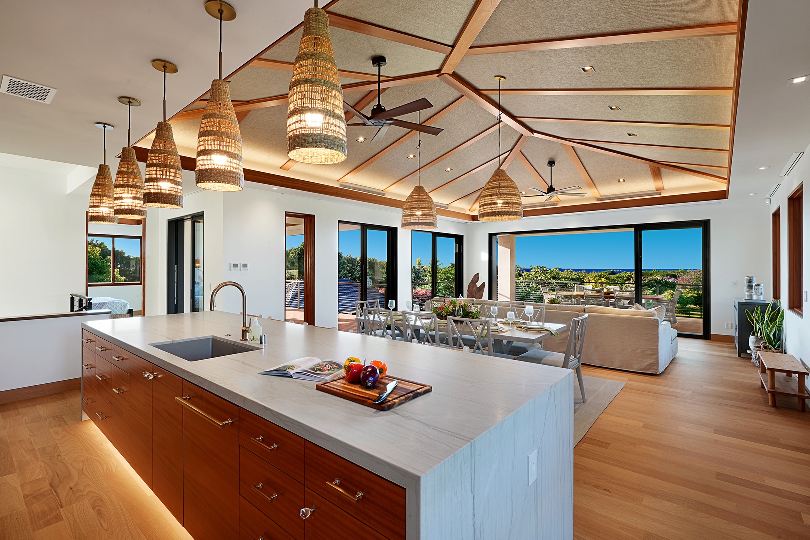 Koloa Vacation Rentals, Hale Kai'Opua - Prepare meals in the gourmet kitchen featuring a modern island and sleek appliances.