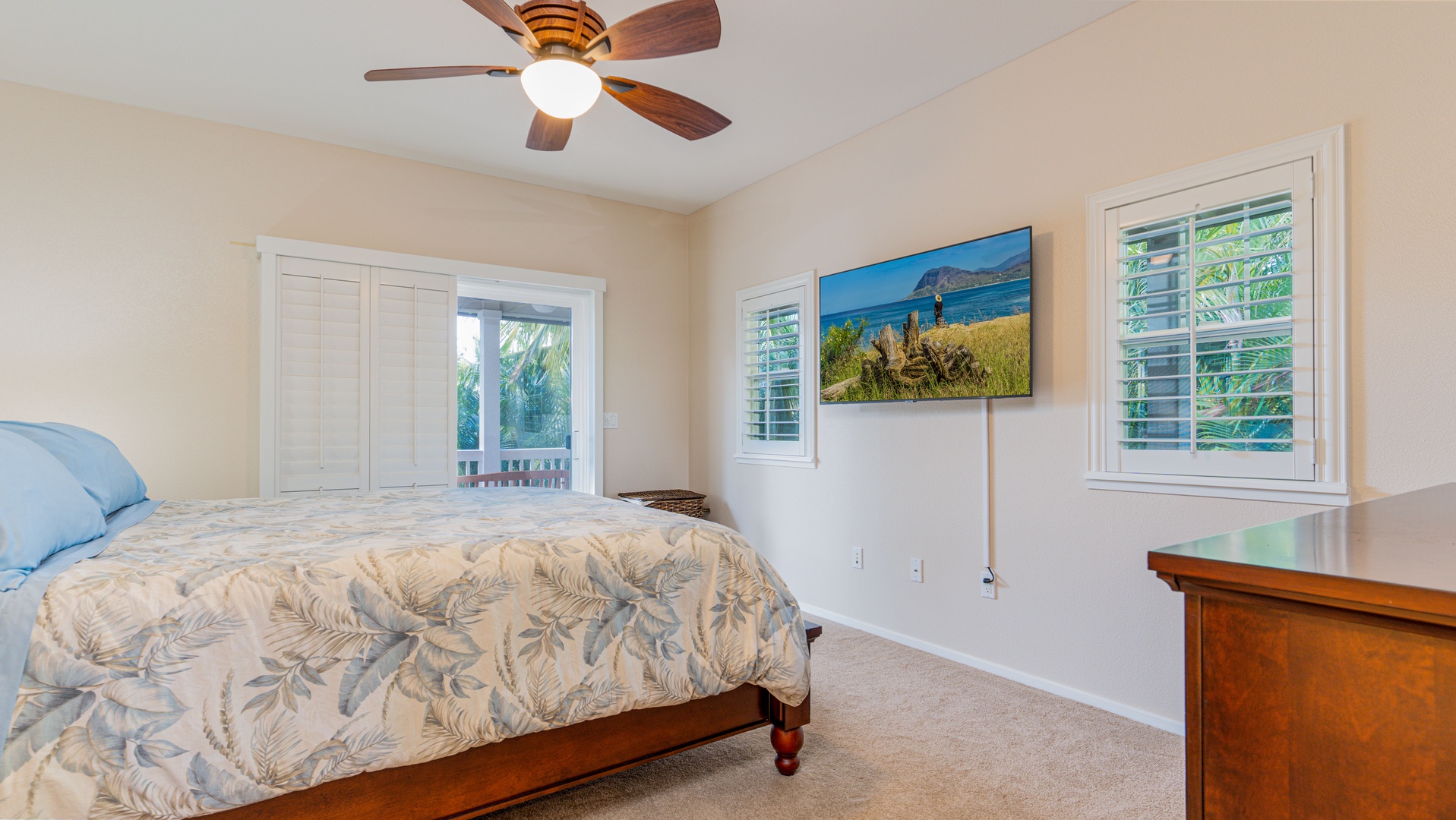 Kapolei Vacation Rentals, Coconut Plantation 1234-2 - The primary guest bedroom with TV and access to the upstairs lanai.