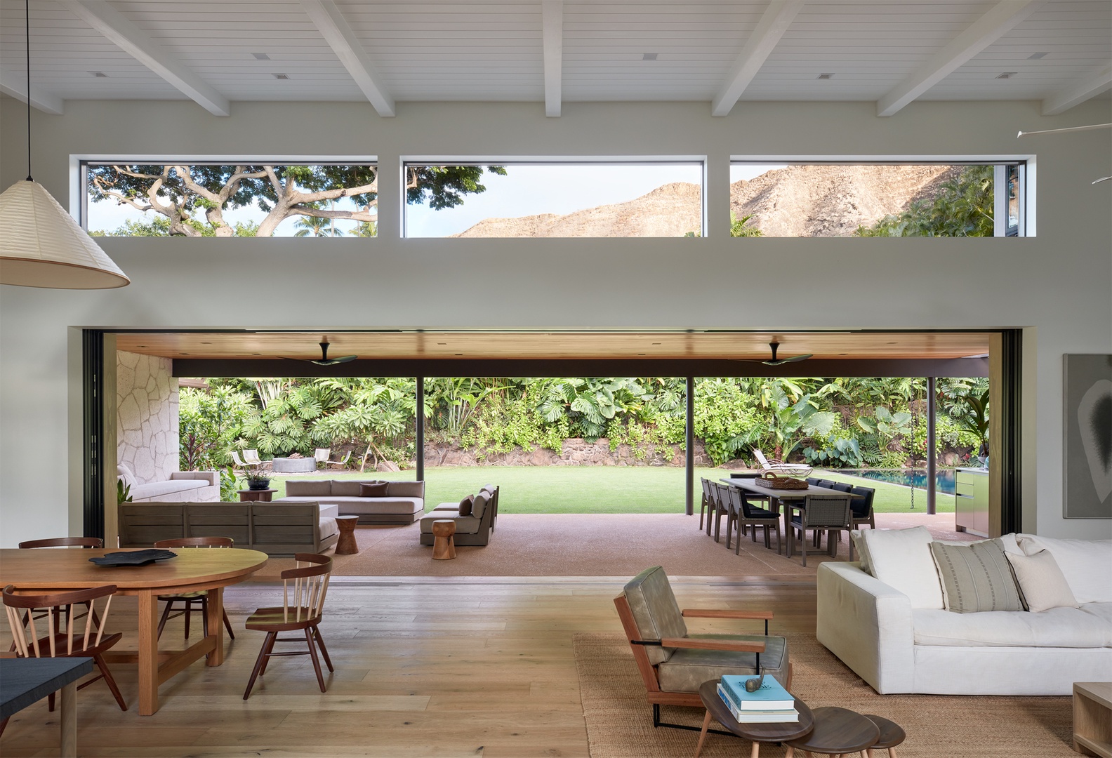 Honolulu Vacation Rentals, Diamond Head Hillside Estate** - Open the wall of glass and let island living take over. The great room flows seamlessly onto the lanai and tropical gardens beyond.