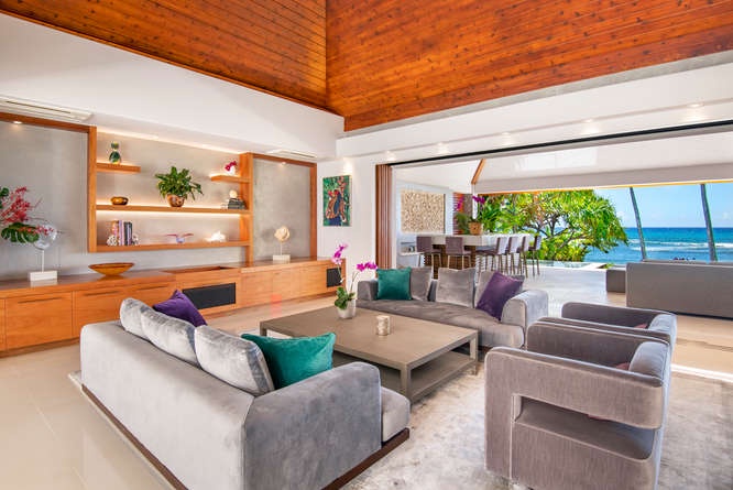 Honolulu Vacation Rentals, Diamond Head Beachfront Estate - Formal living room with vaulted ceilings and custom woodwork—elegance meets island warmth.