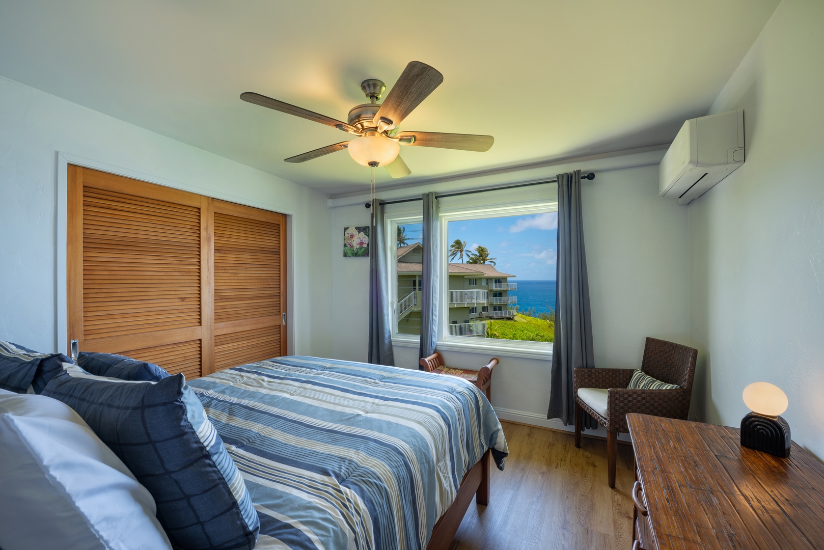 Princeville Vacation Rentals, Moana Kai - A ceiling fan and split A/C keep the bedroom cool for sleeping.