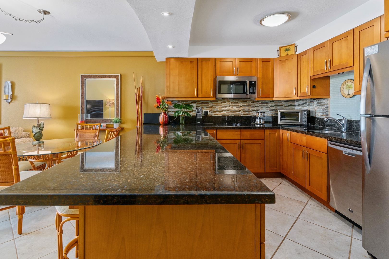 Kihei Vacation Rentals, Kamaole Sands 5310 - Everyone ends up gathered around the long granite island before dinner gets started.