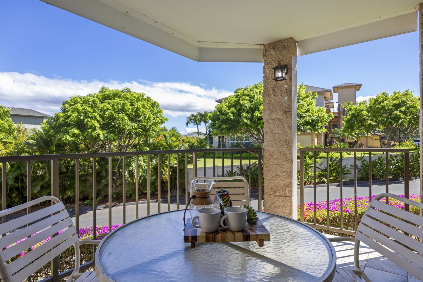 Kihei Vacation Rentals, Kihei Alii Kai C206 - Morning coffee on the lanai, the green canopy for company.