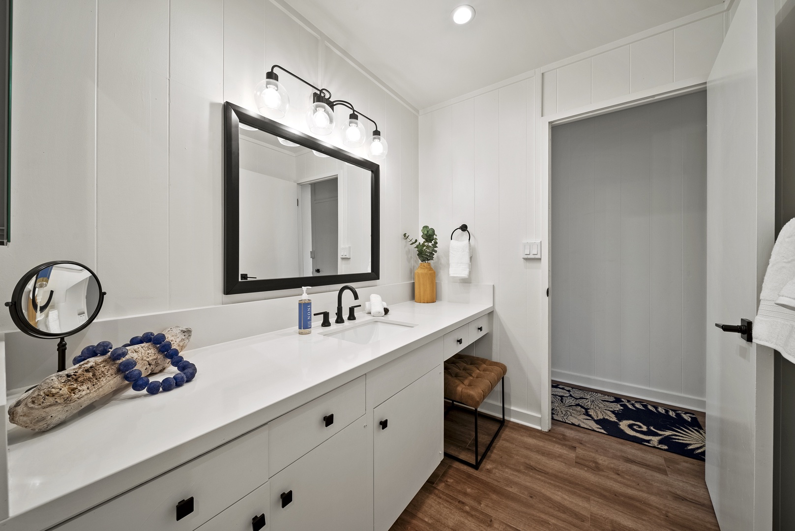 Honolulu Vacation Rentals, Honolulu Beachfront Retreat - Guest bathroom with spacious counters and natural lighting, offering a fresh start to every island day.