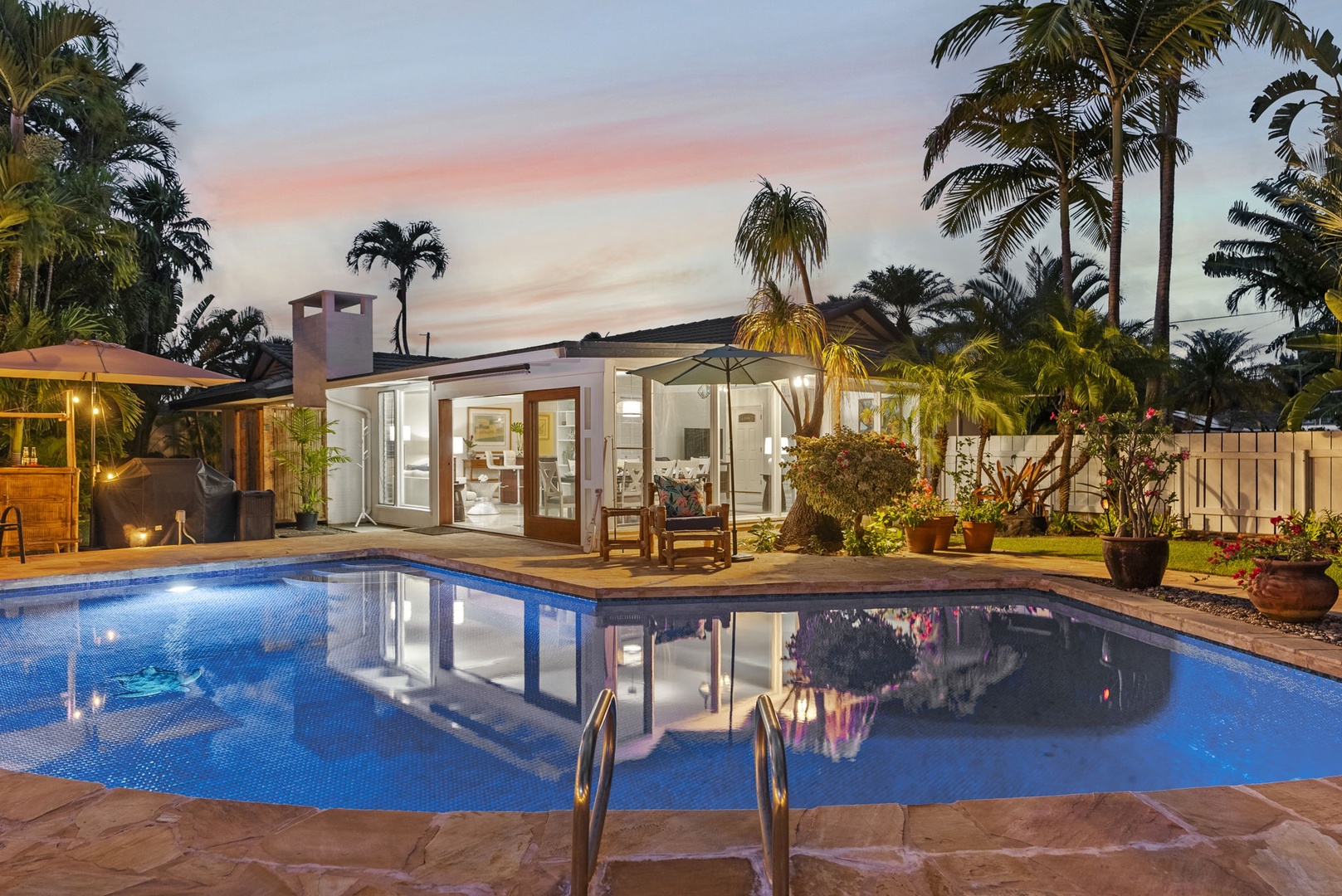 Kailua Vacation Rentals, Hale Aloha - Enchanting evenings await by the shimmering pool under the twilight sky.
