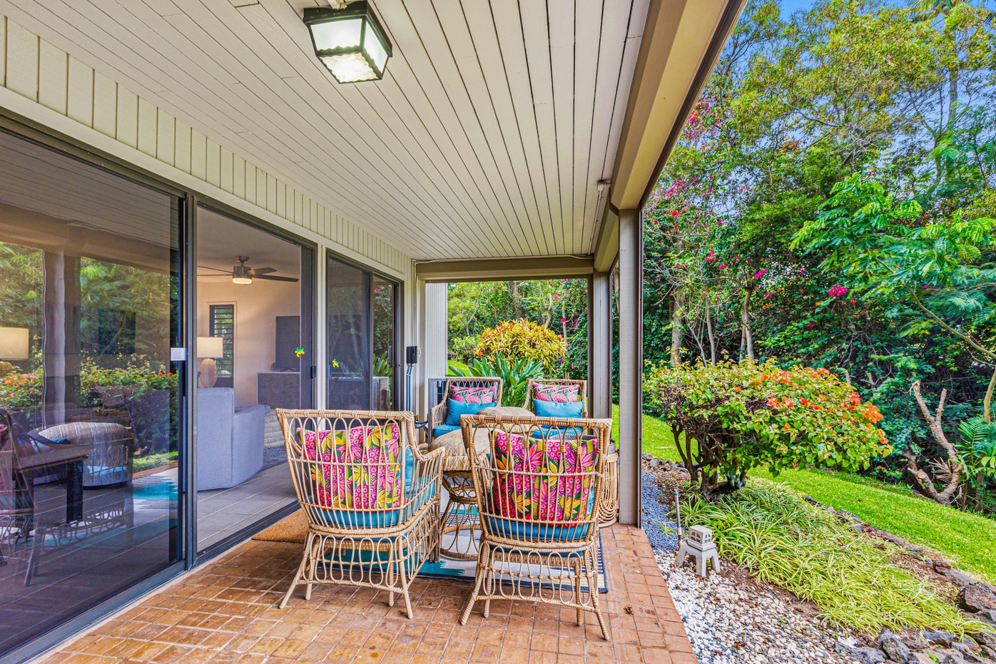 Kihei Vacation Rentals, Wailea Ekolu 1605 - Relax and unwind in this cozy outdoor seating area, perfect for enjoying the surrounding garden views.