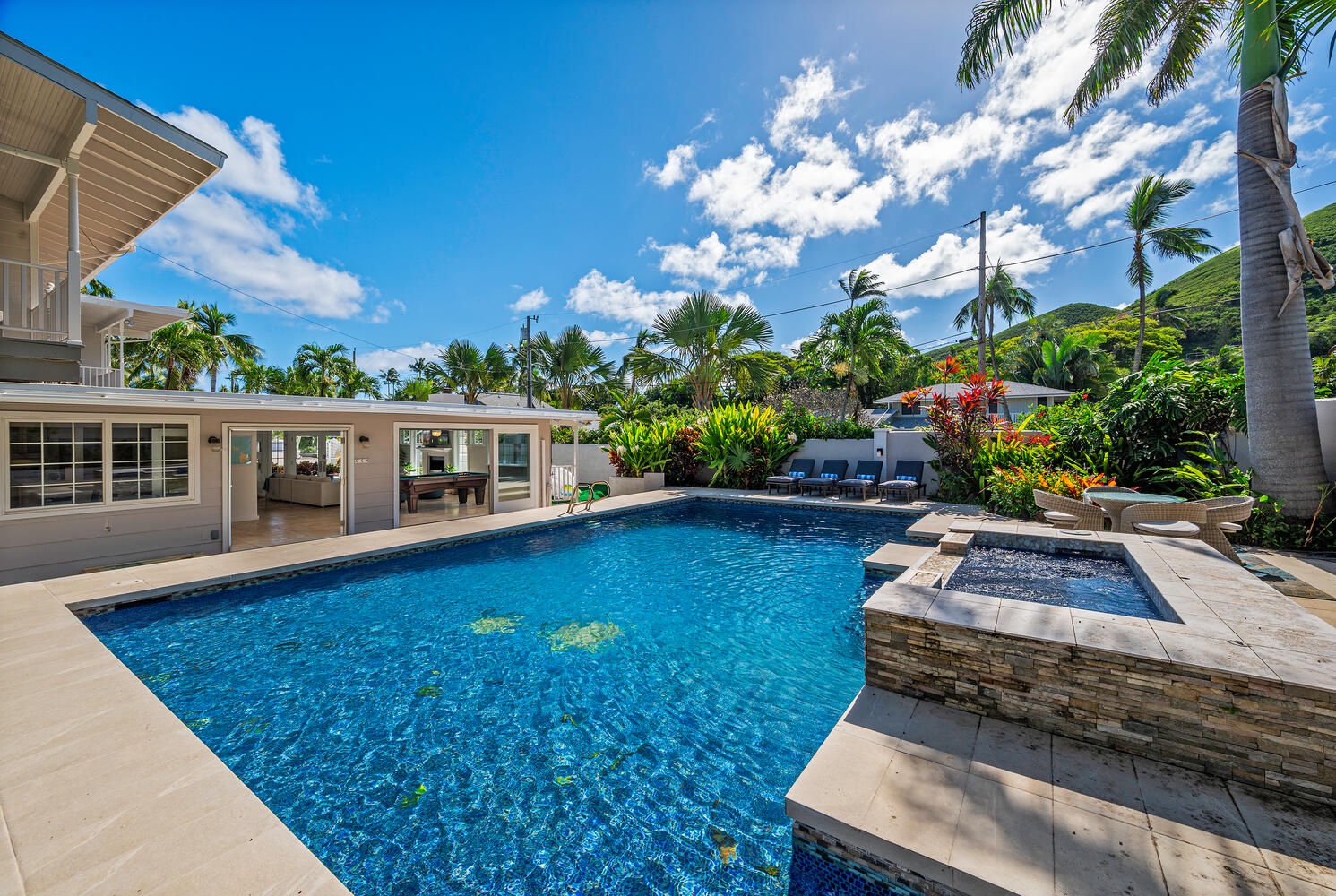 Kailua Vacation Rentals, Villa Hui Hou - Lush backyard with large pool deck and pool give you all the feels of having your own private mini hotel!  (Note: Upper pool area is apart of the pool and NOT a spa)