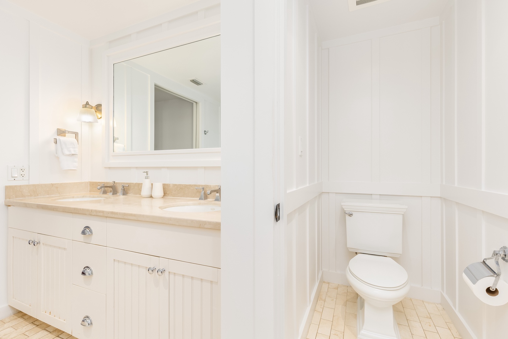 Kahuku Vacation Rentals, Turtle Bay Villas 209 - Refresh in your pristine white bathroom with elegant marble counters and crisp coastal-style cabinetry that creates a spa-like retreat.