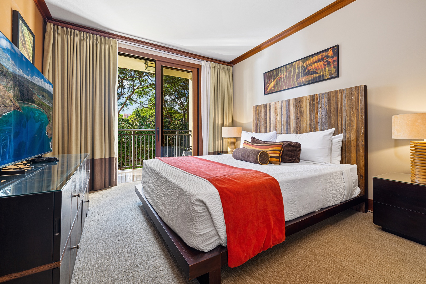 Sink into crisp linens and let warm wood tones embrace you. Your private balcony invites tropical breezes, while soft lighting and elegant artwork create a serene retreat after each adventure.