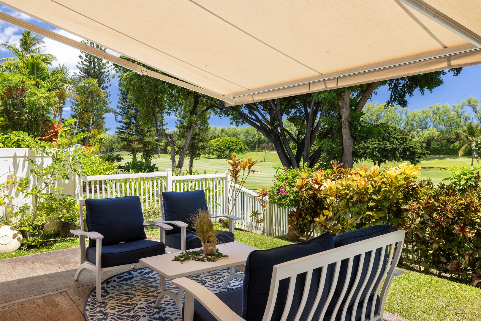 Relax on your private covered patio overlooking lush golf course greens, surrounded by tropical gardens and comfortable seating.