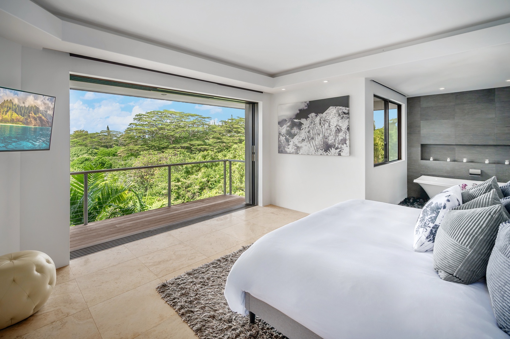 Princeville Vacation Rentals, Hanalei Plantation Villa - Primary suite with expansive windows and breathtaking views, bringing the beauty of nature indoors.