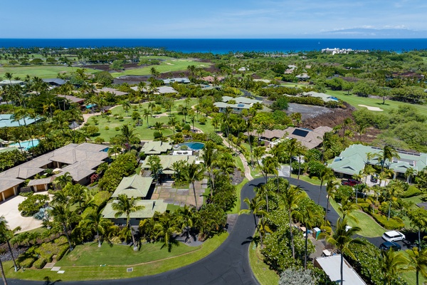 Kamuela Vacation Rentals, Canoe House & Beach Walker at Champion Ridge - A bird's-eye view of the serene neighborhood surrounded by greenery and ocean views.