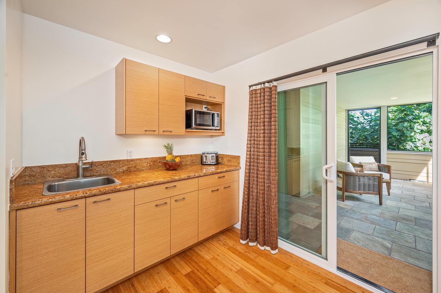 Kailua Vacation Rentals, Hale Honi La - Lower level primary wet bar and indoor/outdoor lanai