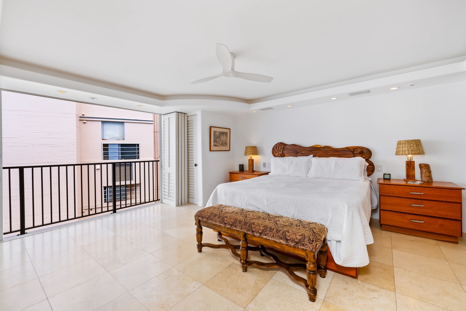 Honolulu Vacation Rentals, Kaimana Views - Bright, airy bedroom with a private balcony and classic decor—enjoy restful nights and peaceful mornings here.