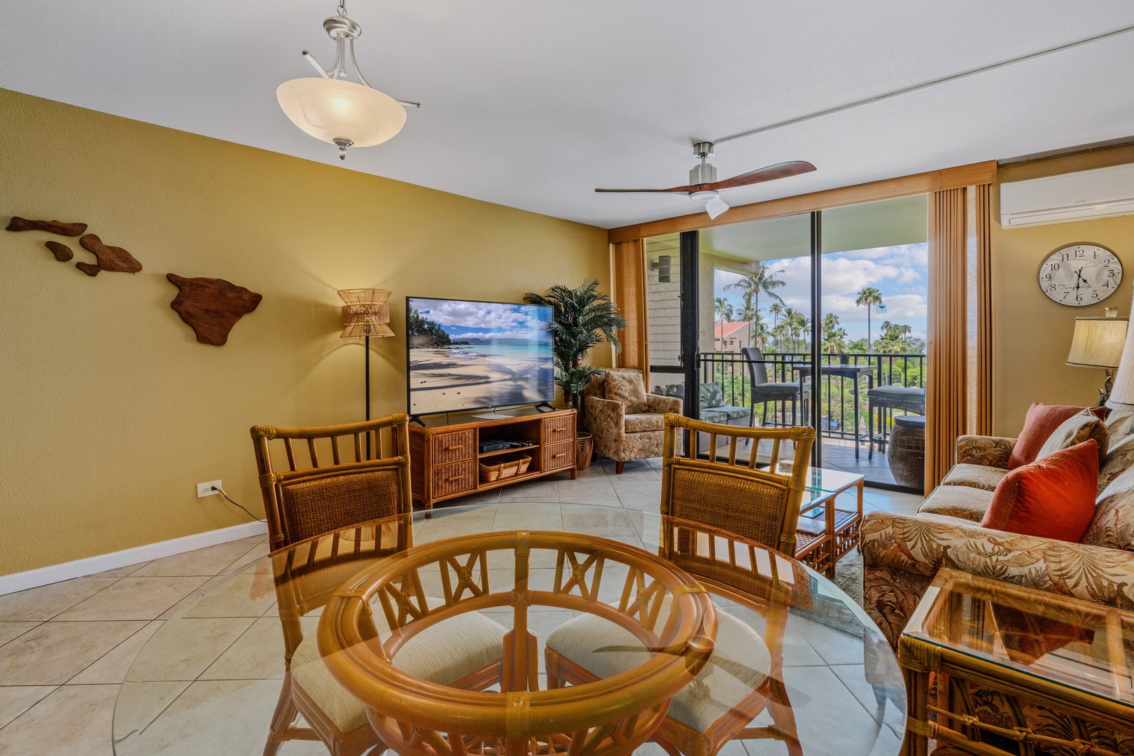 Kihei Vacation Rentals, Kamaole Sands 5310 - The carved wood map of the islands by the TV beats the usual rental art by a mile.