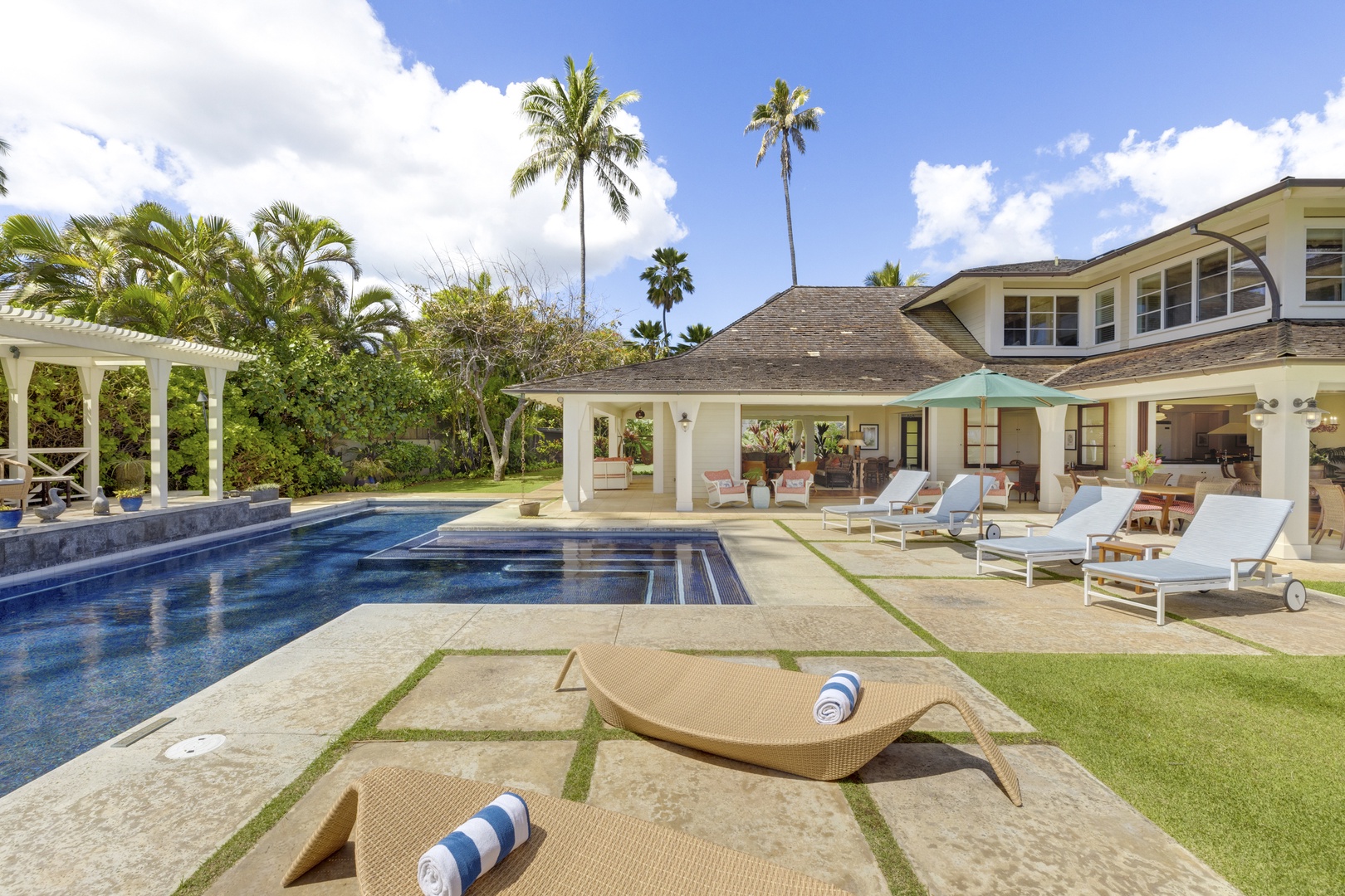Honolulu Vacation Rentals, Kahala Beachside Estate - Pool deck, with plenty of lounge options