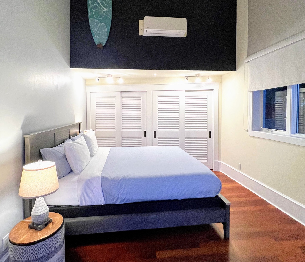 Kailua Vacation Rentals, Lanikai Villa - Guest Bedroom 3 is equipped with a king bed, garden views, and split A/C
