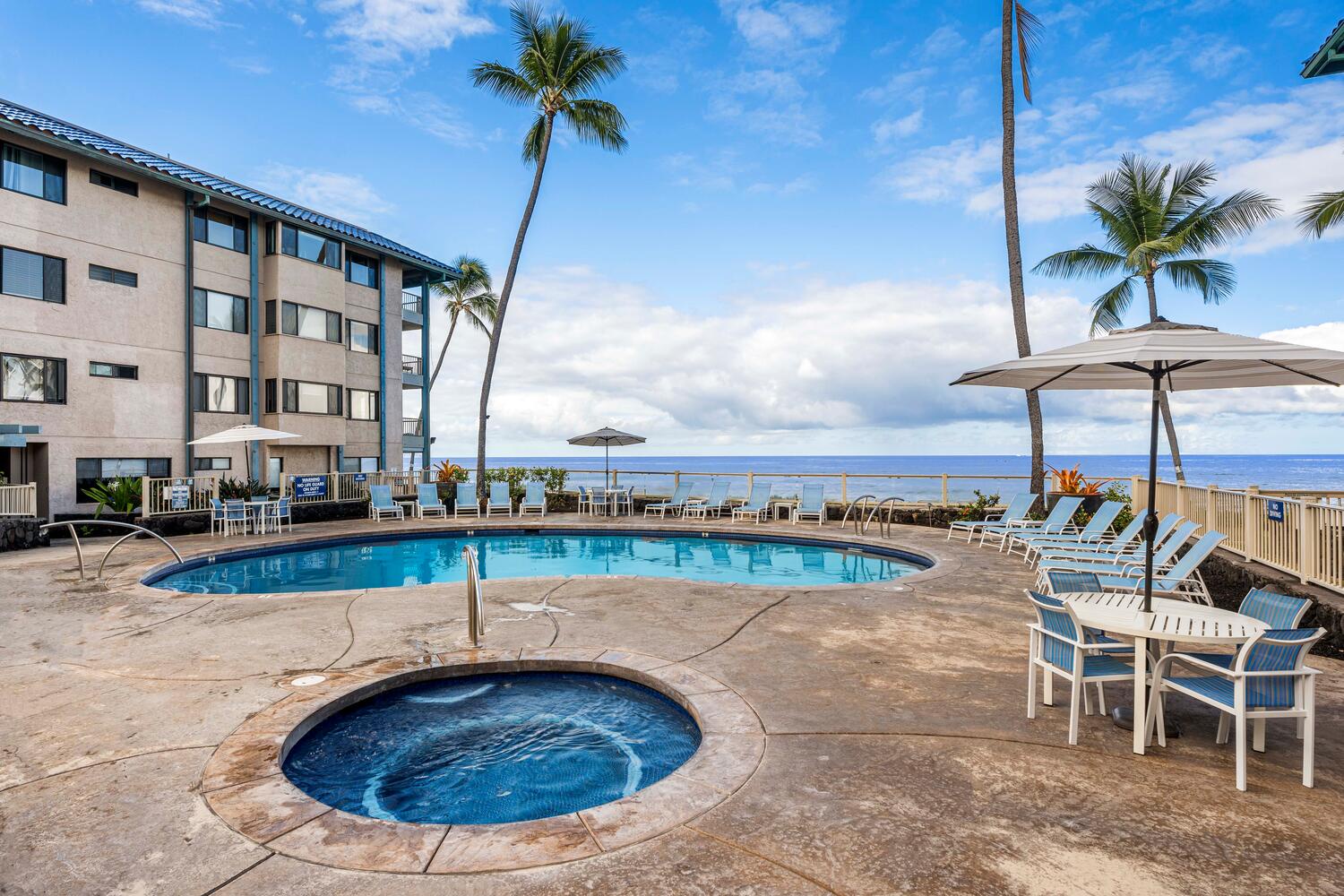 Kailua Kona Vacation Rentals, Kona Reef F11 - View of the Oceanfront Pool Area and Spa at the Kona Reef complex.