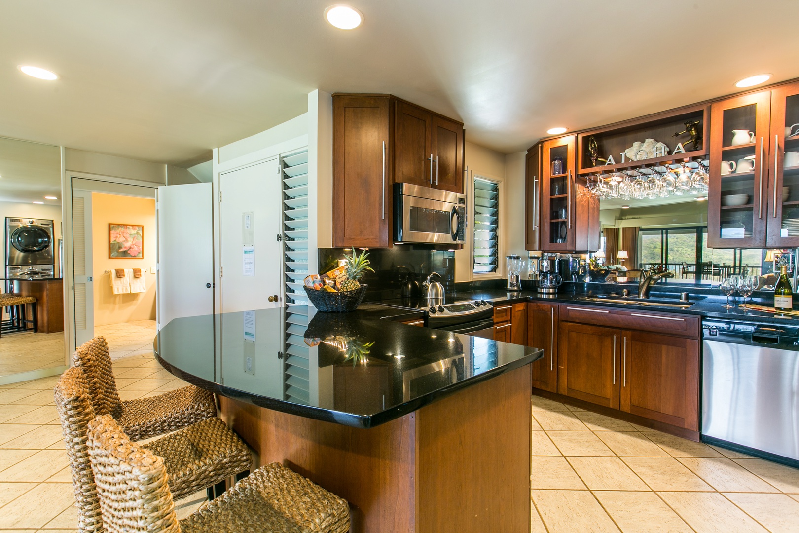 Princeville Vacation Rentals, Hanalei Bay Resort 4301/2/3 - Conveniently prep meals in the fully equipped kitchen with bar seating for three. – A great spot for casual breakfasts or chats while cooking.