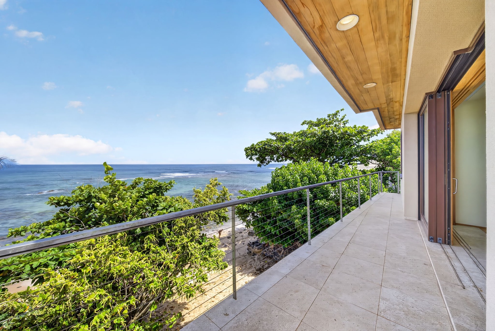 Haleiwa Vacation Rentals, HaleGator - The wraparound lanai offers multiple vantage points to soak in panoramic shoreline views and unforgettable North Shore sunsets.