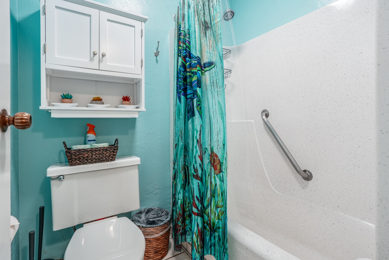 Kapaa Vacation Rentals, Nani Hale - Enjoy a refreshing rinse after beach days in this colorful, island-inspired bathroom featuring a combo tub and shower setup.